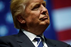 Donald Trump is being sued by Maryland and the District of Columbia for 'unprecedented' corruption involving his company. (Photo by Drew Angerer/Getty Images)