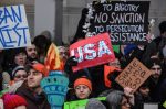Protestors rally against the Muslim immigration ban at John F. Kennedy International Airport in New York City. President Trump signed the controversial executive order and is being sued for allegedly violating the constitution. (Photo by Stephanie Keith/Getty Images)