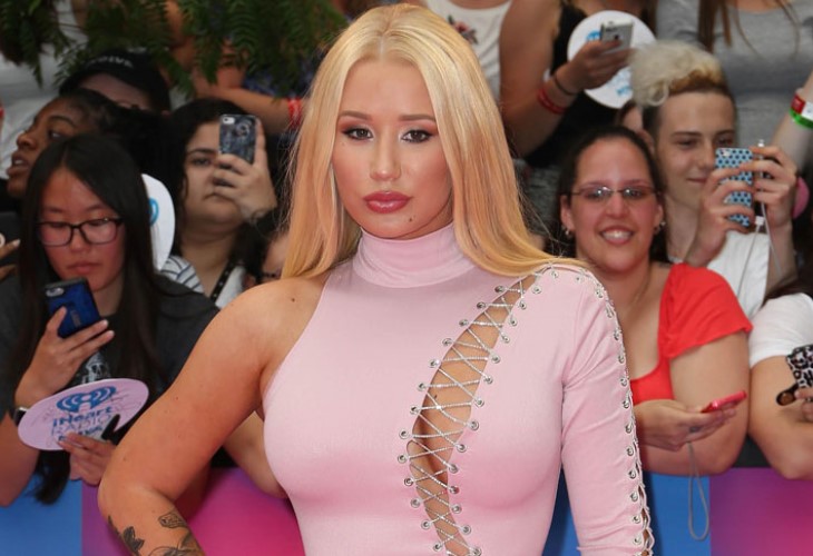 Iggy Azalea is expressing outrage and shock a weekend leak of topless photos, saying the photographer violated her trust. (Photo: BangShowBiz)