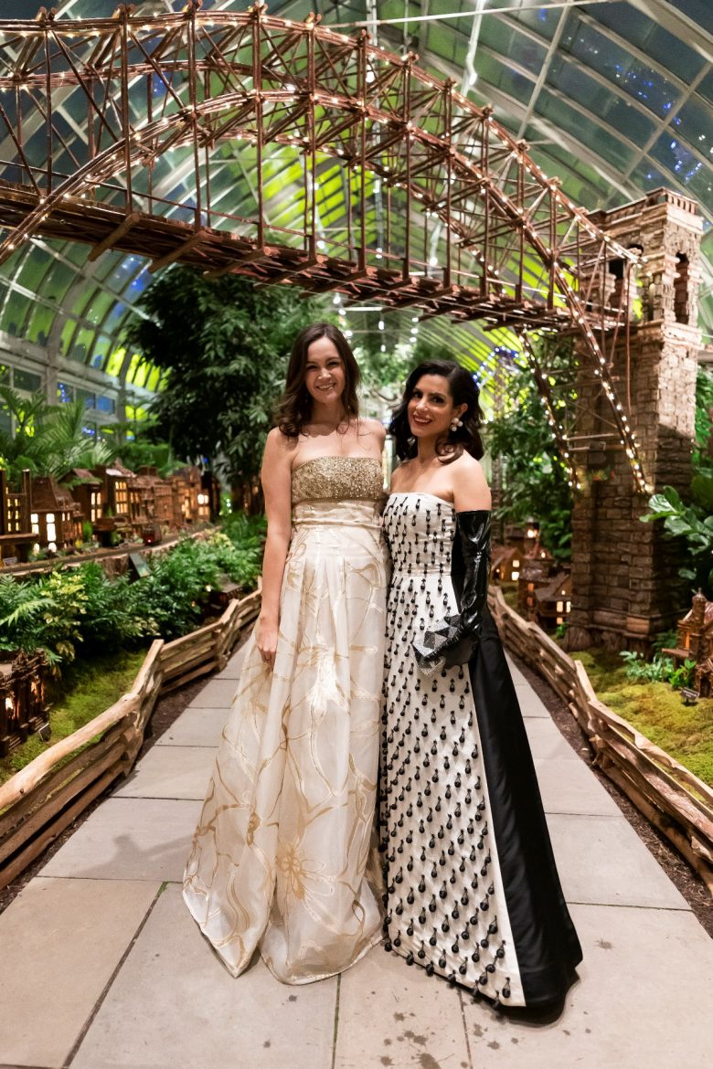 Mercedes de Guardiola and Lizzie Asher are captured in front of the NY Botanical Garden's stunning train display. (Photo: BFA)