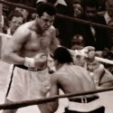 Muhammad Ali squares off against Jimmy Young in 1976. Ali's memorabilia is expected to draw high rollers when it goes up for auction Sept. 10. (Photo by Keith Girard)