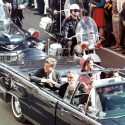 President Kennedy, his wife, Jacqueline and then-Texas Gov. John Connley ride in an open car during their Dallas motorcade on Nov. 22, 1963.