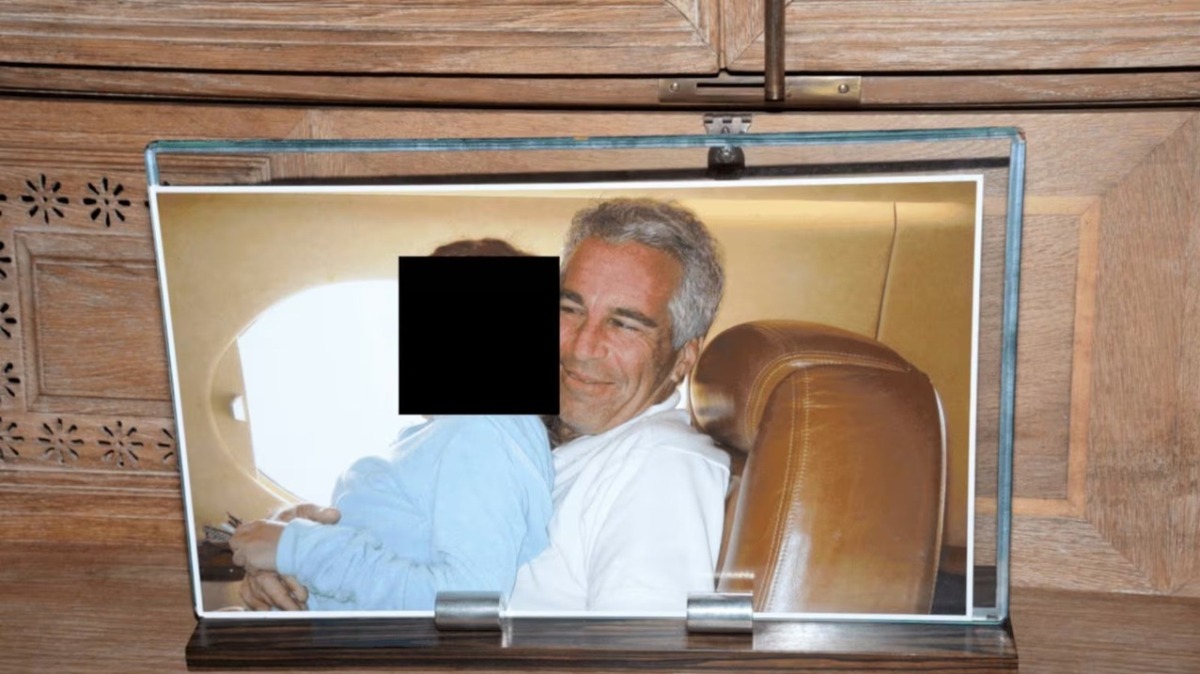 This photo seized by the FBI shows Jeffrey Epstein on his private jet, the'Lolita Express' with an underage girl, whose face has been redacted. (Photo: DOJ)