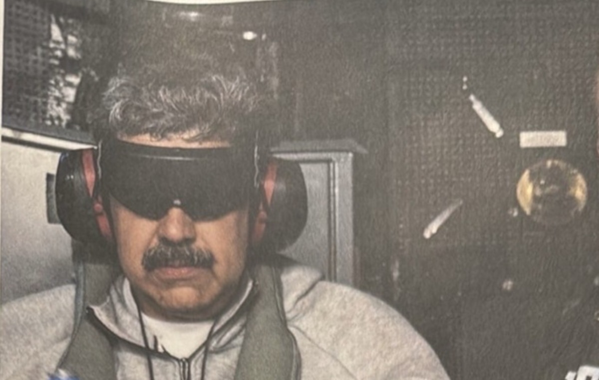 Venezuelan President Nicholas Maduro in handcuffs aboard the USS Kitty Hawk. (Photo: Government)