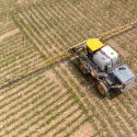 A farmer spreads liquid fertilizer on crops during planting season. (Photo