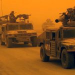 U.S. troops are engulfed by a sandstorm during the 2003 Iraq invasion. Trump is caught in the same trap. (Photo: U.S. Marines)