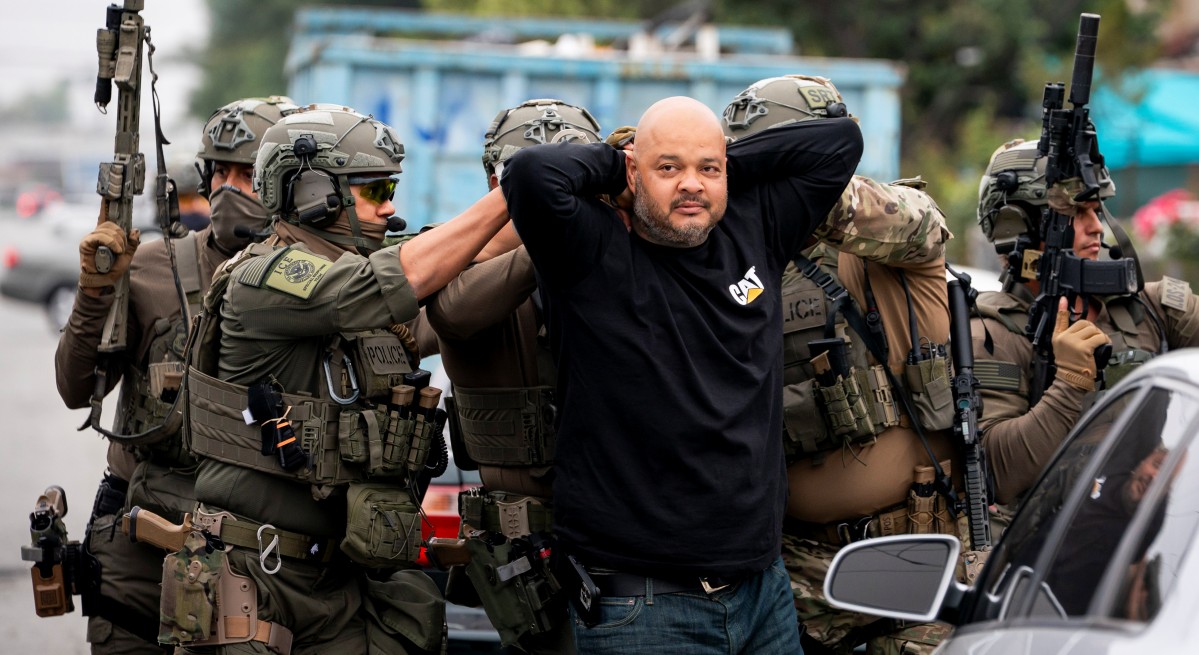 ICE agents detain a person during a sweep in Los Angeles. (Photo: USGovt.)