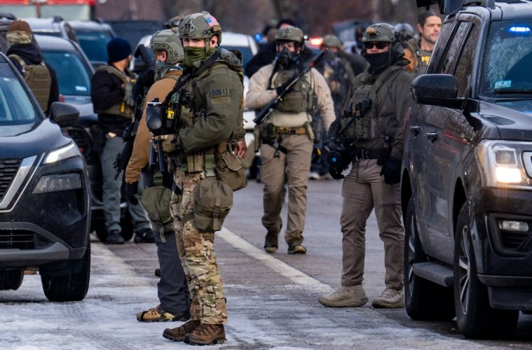 Federal ICE agents congregate on Portland Ave in Minneapolis near where Renee Good was shot to death. (Photo: Chad Davis)