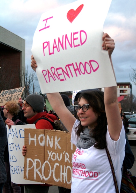 Supporters rally for Planned Parenthood. (Photo;
